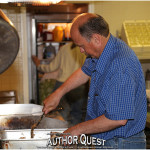 Counselor Ken Marlin helps in the kitchen.