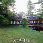 The sun rises over the main lodge at Author Quest